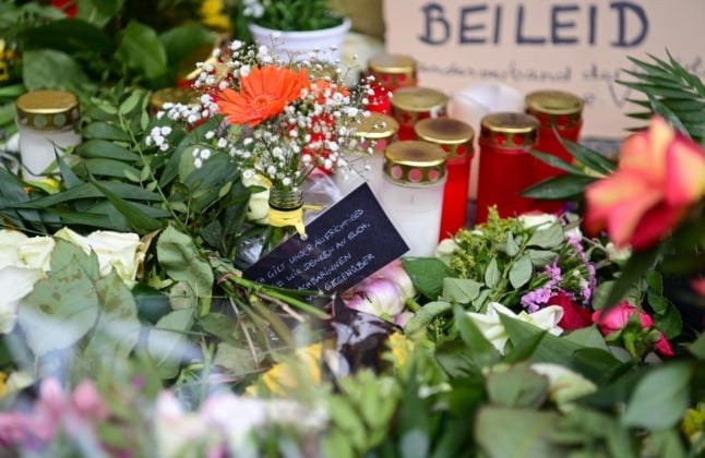 Tributes laid where four people were killed at a care home in Potsdam. 