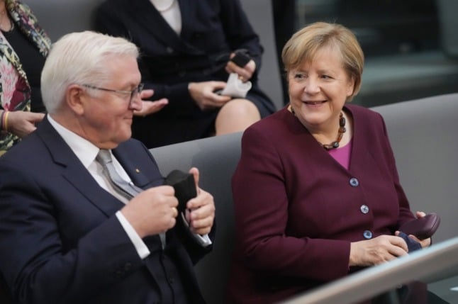 Chancellor Angela Merkel with German President Frank-Walter Steinmeier in the Bundestag on Tuesday. 