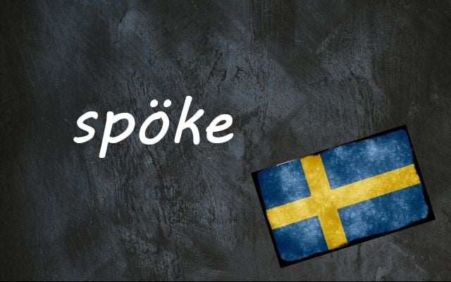 the word spöke written on a blackboard next to the swedish flag
