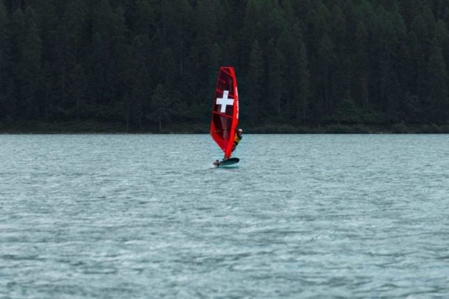 A person windsurfing on Lake Silvaplana, Switzerland