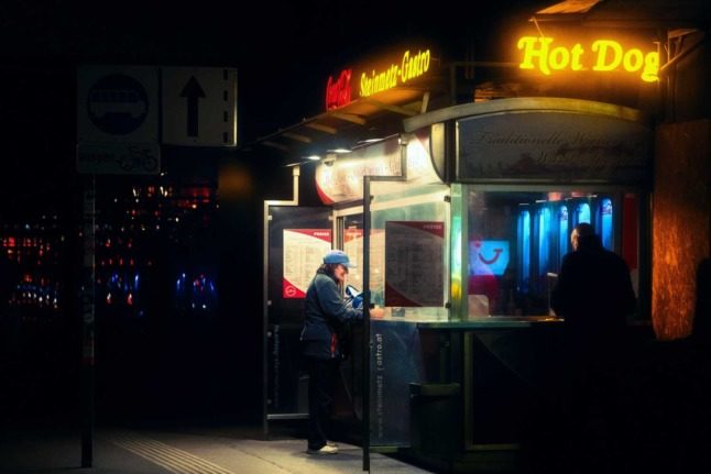 A hot dog stand in Vienna late at night. Photo by Alex Rainer on Unsplash