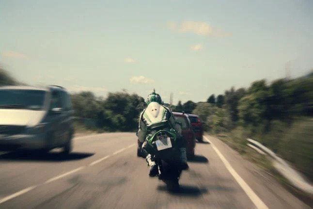 motorbike on Spanish road overtakes