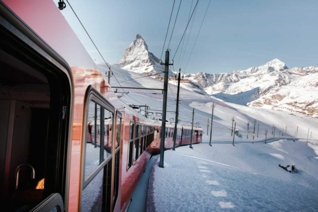 A train pulls away from the Matterhorn in Zermatt in Switzerland