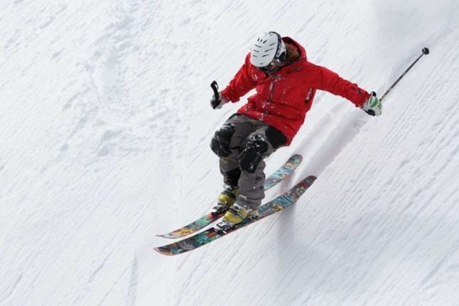 A person skis down a slope at high speed