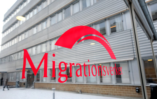 file photo of a migration agency office and logo