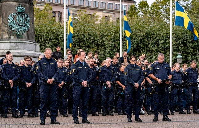Swedish police standing during a minute of silence