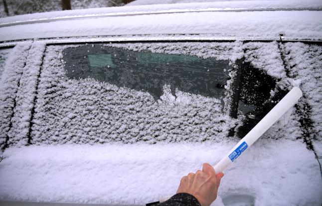 file photo of a car covered in snow