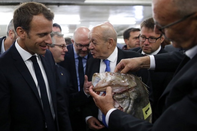 Emmanuel Macron on a visit to a French fish market in 2018.