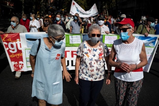 Three pensioners lead a protest against pension reform in Toulouse, France, 2020. 