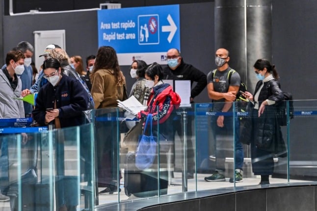 People queue for Covid testing at Rome's Fiumicino airport.