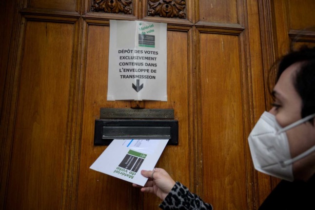 A person votes in a referendum in Switzerland