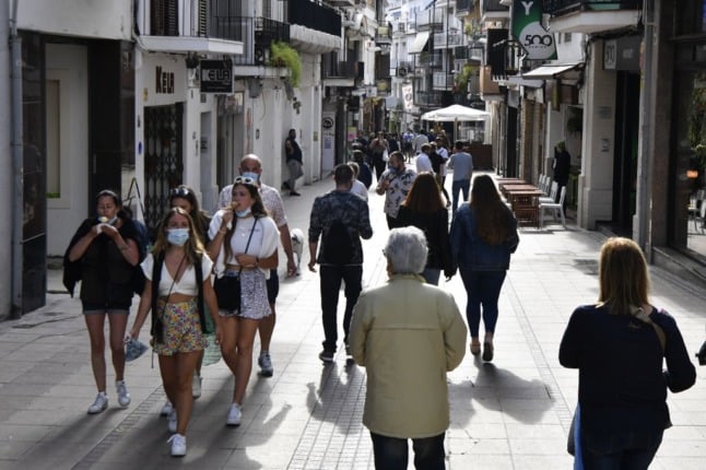 People stroll around the Catalan town of Sitges in May 2021.