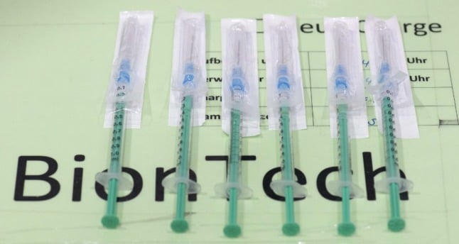 Syringes with the vaccine of BioNTech lie on a tray at the district vaccination center in Ludwigsburg, southern Germany,