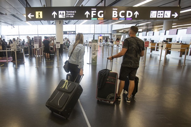 People wearing masks at Vienna's airport.