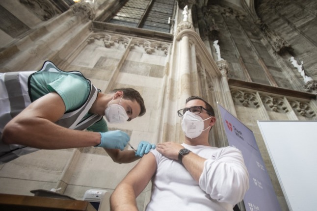 A man gets a vaccine at the vaccination center installed at the Barbara Chapel of the famous St Stephen's Cathedral in Vienna.