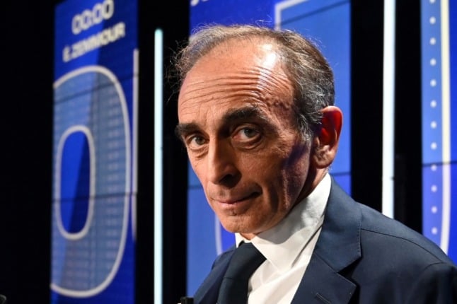 Far-right pundit, Éric Zemmour, gives an icy stare to the camera. He is facing charges of using racist hate speech. 