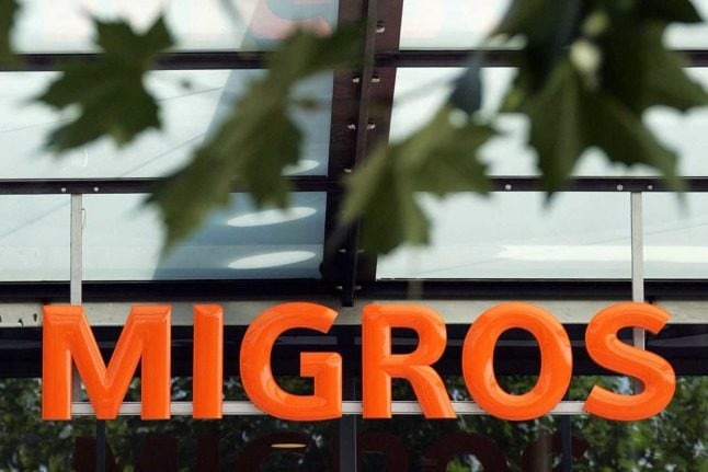 The familiar orange sign of Swiss supermarket Migros. 