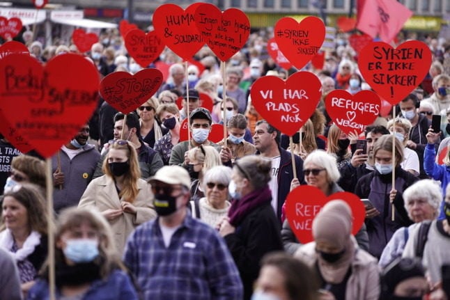 People demonstrate against Denmark's withdrawal of refugee status from some Syrian nationals, in Copenhagen in May 2021.