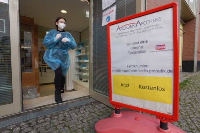 A sign outside a chemist in Berlin shows Covid-19 rapid tests are free of charge. 