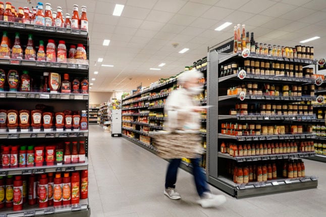 Woman shopping in German supermarket