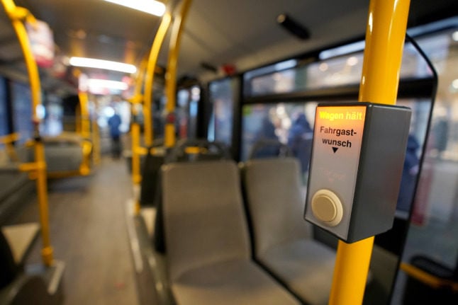 An empty bus travels through the city of Hamburg