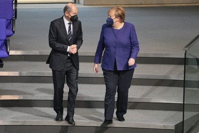 Chancellor in waiting Olaf Scholz and outgoing Chancellor Angela Merkel in the Bundestag 