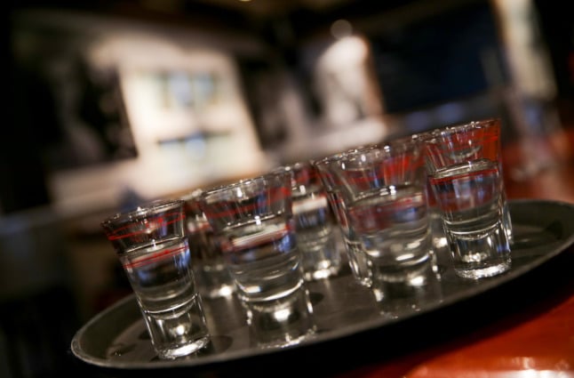 Filled shot glasses on a tray