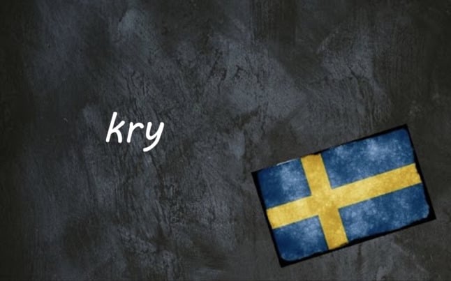 the word kry on a blackboard next to a Swedish flag