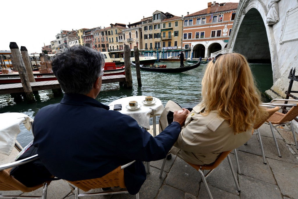 People drinking coffee in Venice