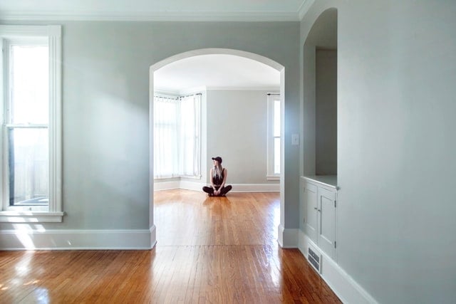 Woman in empty apartment