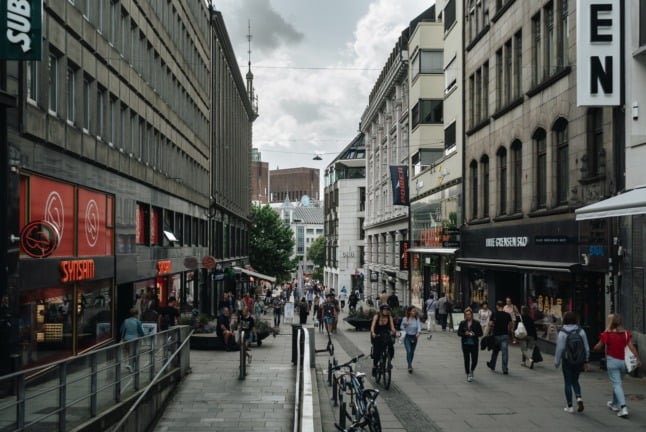 Pictured is a busy shopping street in Oslo. 
