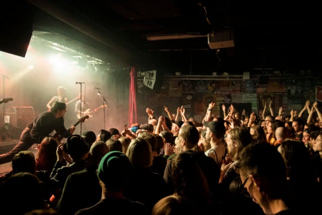 a crowd at a concert indoors