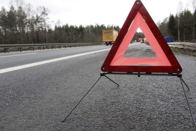 A warning triangle on a road in winter