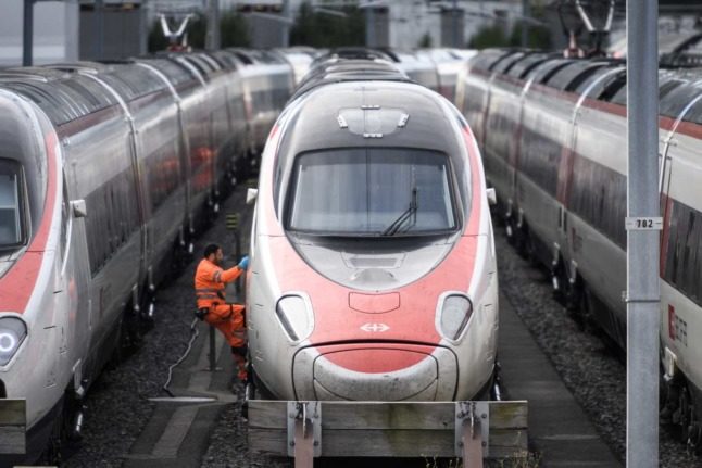 A worker climbs into an SBB train somewhere in the beautiful country of Switzerland