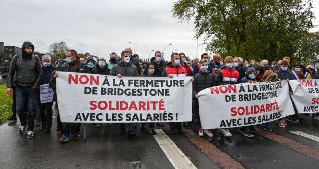 French protestors hold a sign bearing the word 'solidarité' - a key concept in the country's national identity.