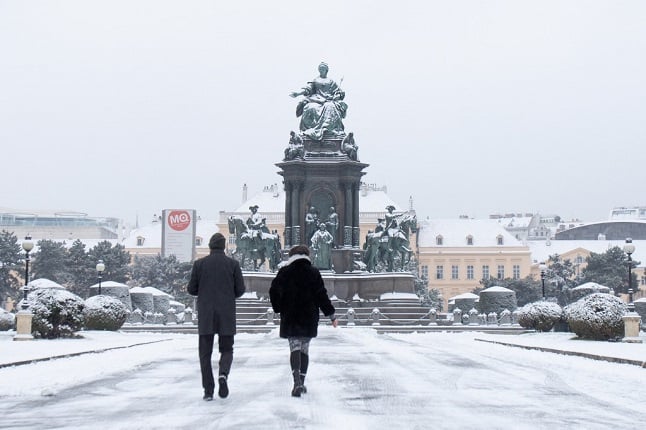 people walk in Vienna snow
