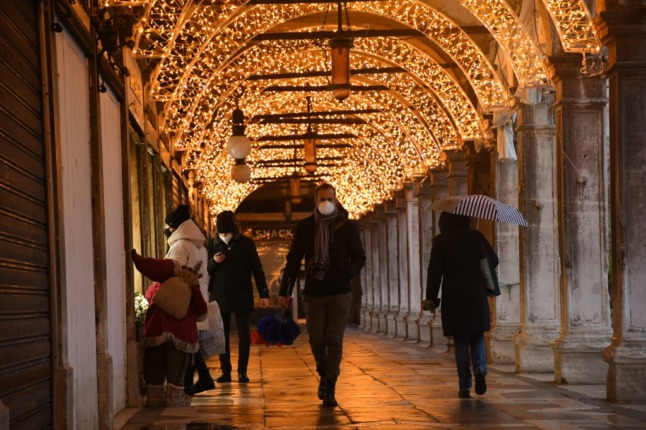 People shop in Venice.