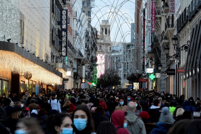 People shop for Christmas in the centre of Madrid.