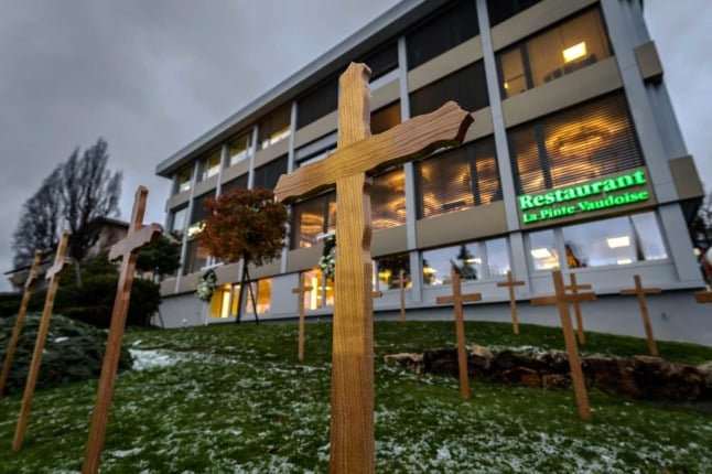 A wooden cross outside a Swiss hotel and restaurant in the canton of Vaud