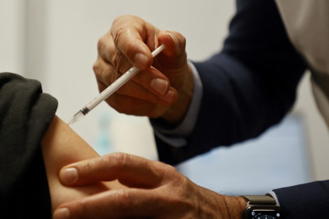    A woman is vaccinated with the AstraZeneca vaccine against Covid-19.