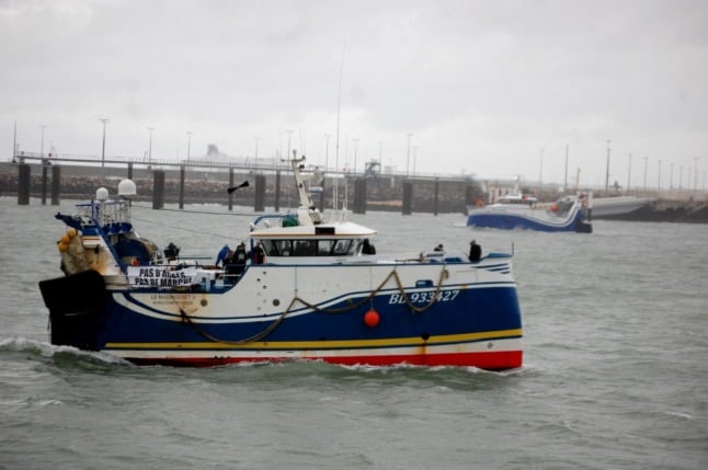 Fishing boats block the entrance to the port of Calais in November. Today is the deadline for the British government to issue post-Brexit fishing license to French fishermen.