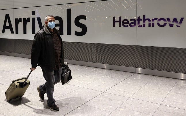 A man arrives at Heathrow's Terminal 5 in west London on November 30strictions on travellers are introduced. - All passengers en