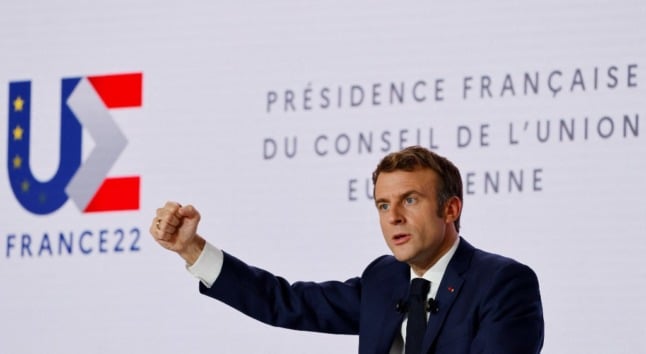 French president Emmanuel Macron gestures as he  delivering a speech
