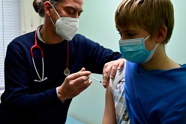 A child receives a vaccine against Covid-19