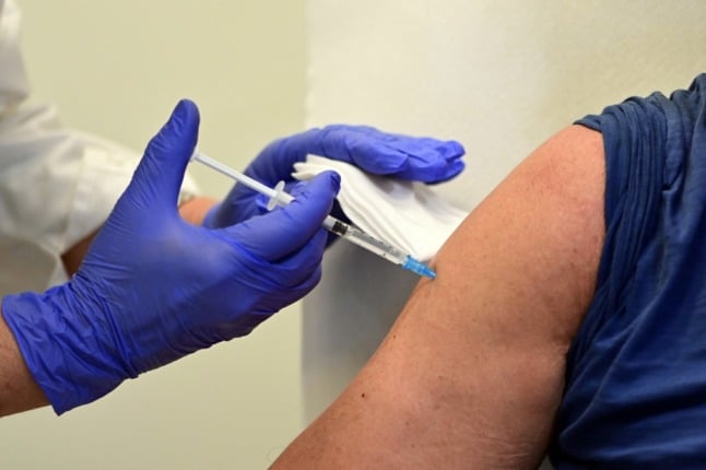 A health worker administers a dose of the Johnson & Johnson Covid-19 vaccine.