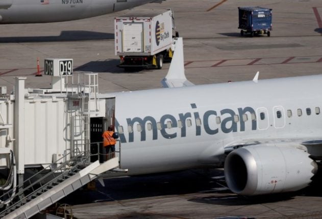 An American Airlines plane parked at its gate in the Miami International Airport