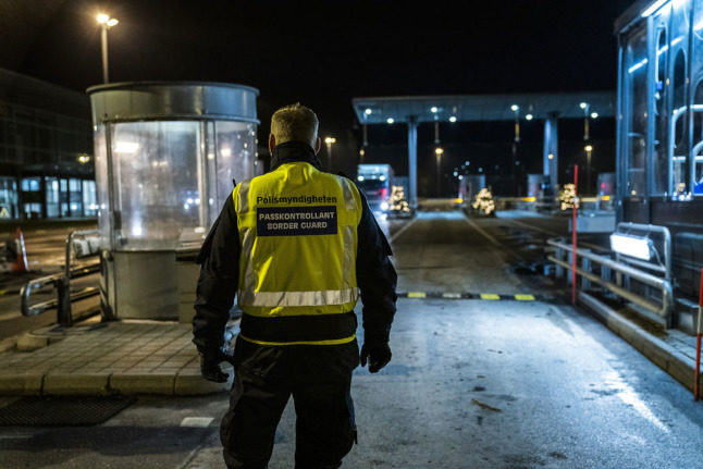 A Swedish border guard at the Øresund Bridge in December 2020. Sweden is set to reintroduce restrictions on travel from Denmark.