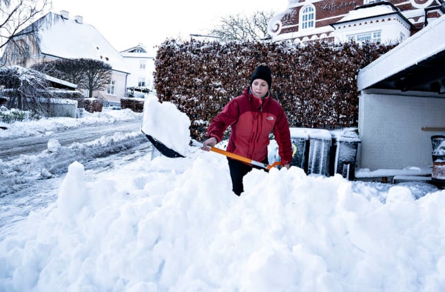 An Aalborg resident shovels snow from her driveway on December 2nd.