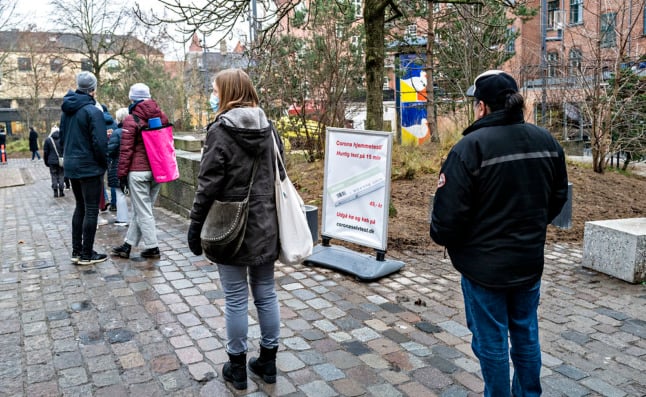 People queue for Covid-19 tests in Denmark in December 2021. The country registered over 23,000 new cases on December 29th.