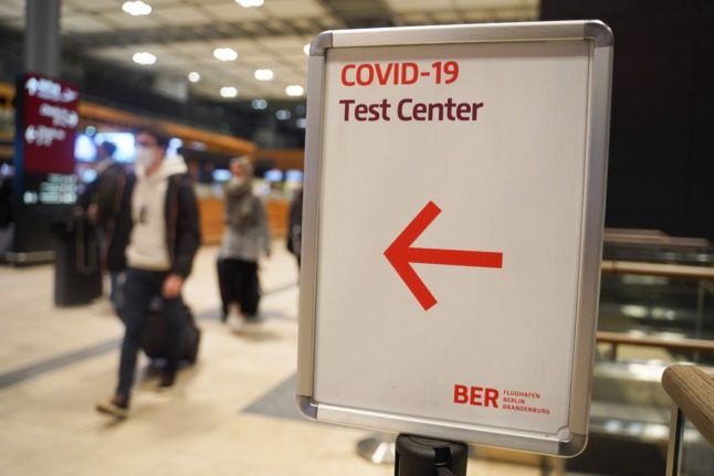 A sign to a Covid-19 test centre in Berlin's airport. 